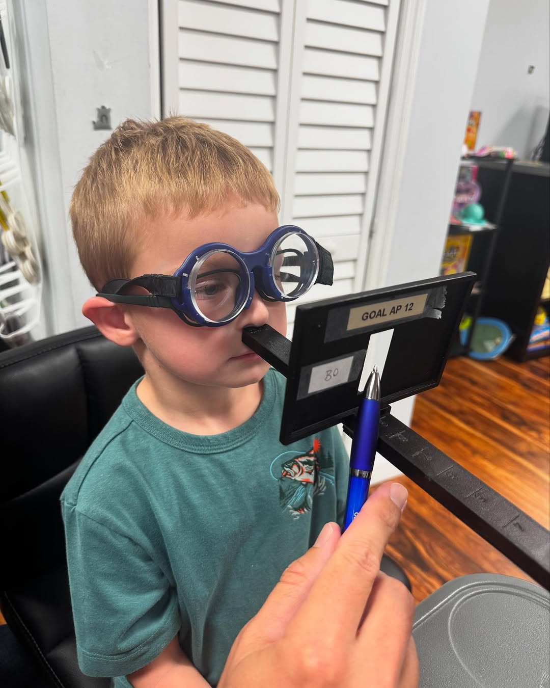 A young patient working the Aperture Rule during a vision therapy session