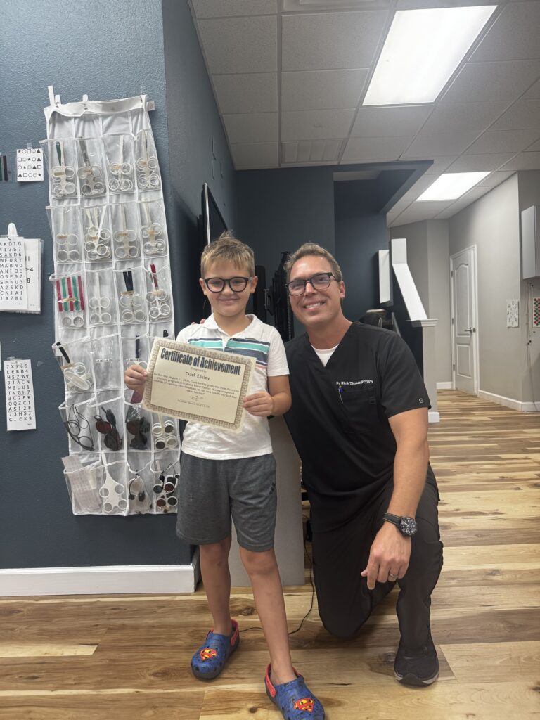 Clark celebrating his vision therapy graduation