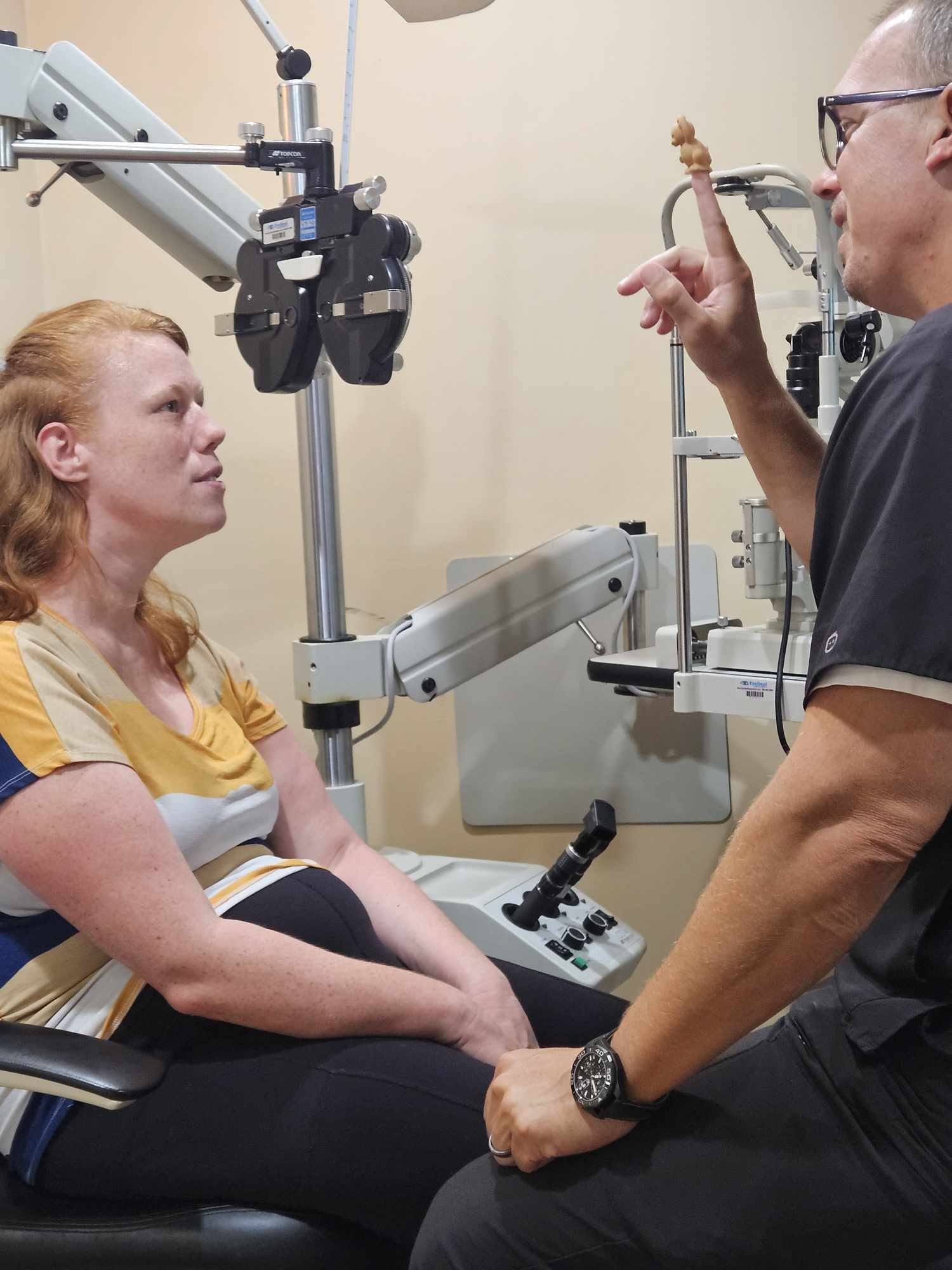A Walesby doctor running a fixation test with a patient at the exam lane