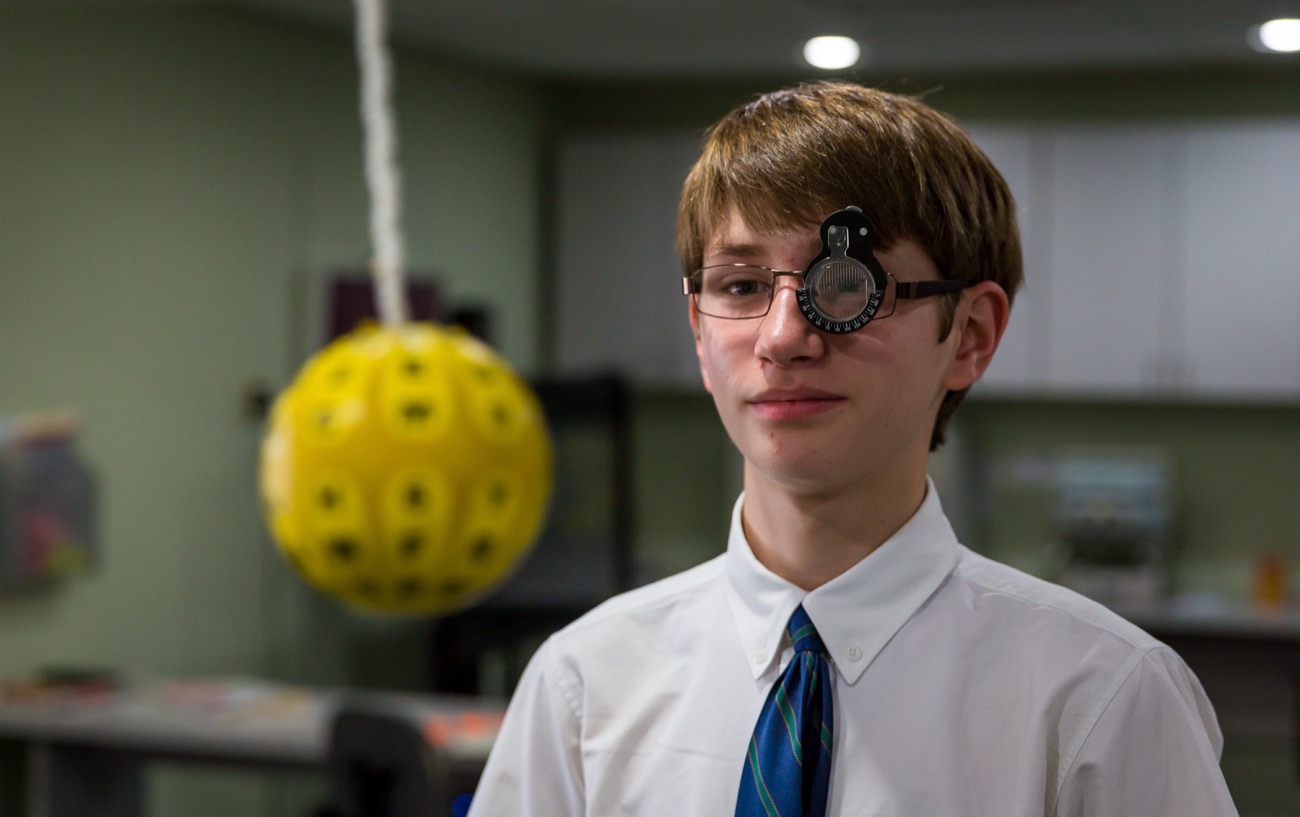 A Walesby patient wearing a trial frame during a tracking exercise